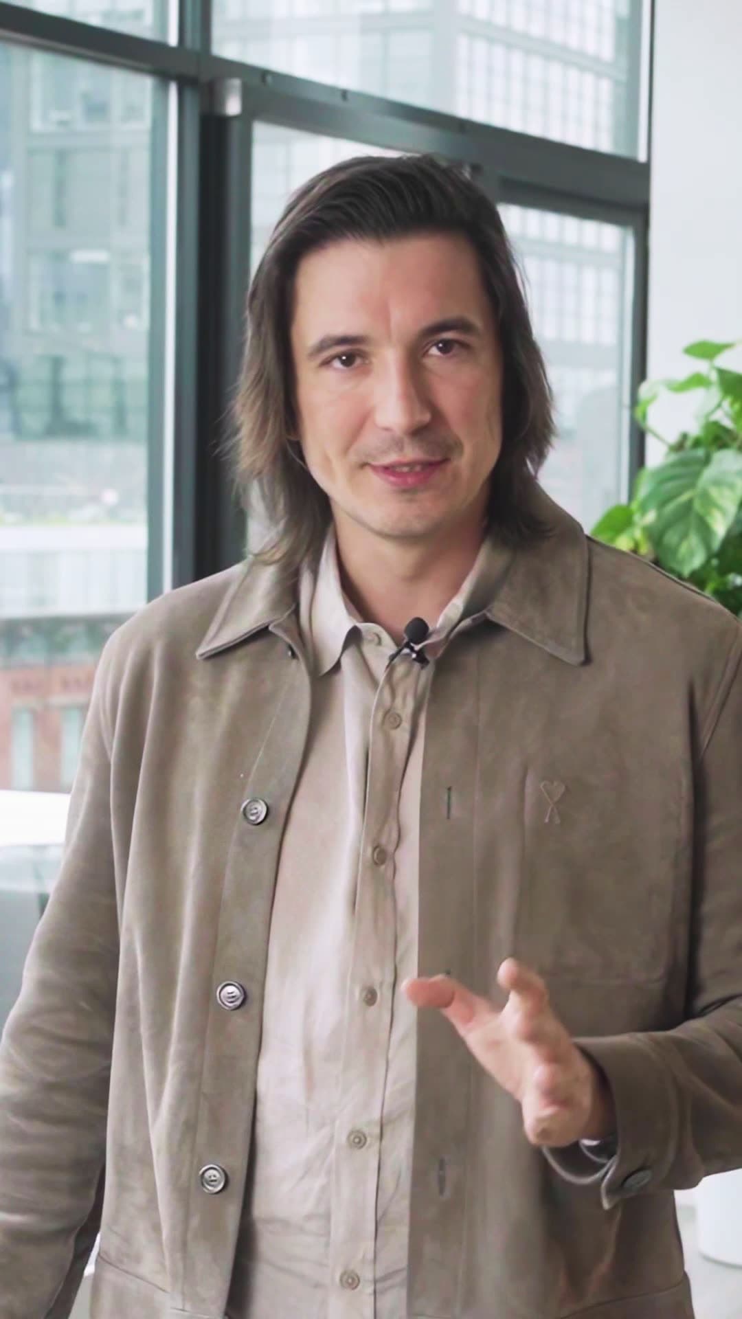 Still from the Robinhood Q2 2026 earnings reel: a presenter addressing camera in a windowed office.