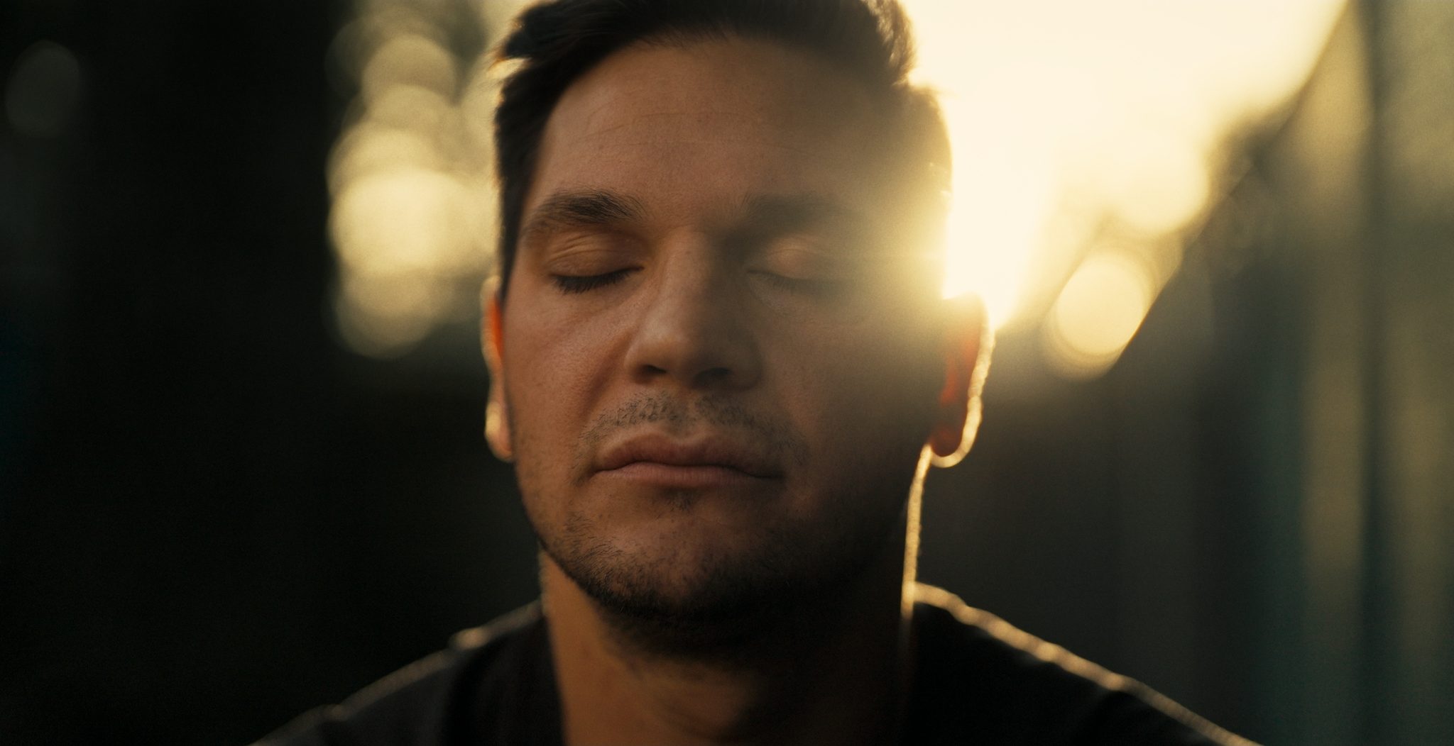 Daniel Carcillo, eyes closed at golden hour